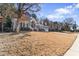 Beautiful two-story home showcasing manicured lawn, dormer windows, and a two-car garage at 104 Glenmore Rd, Cary, NC 27519