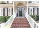 Close-up of the front door with decorative glass, sidelights, and a brick staircase at 104 Glenmore Rd, Cary, NC 27519