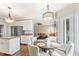 Cozy breakfast nook with a round table and chairs, connected to an open kitchen design at 104 Glenmore Rd, Cary, NC 27519