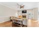 Inviting living room with a brick fireplace, stylish furnishings, and lots of natural light at 104 Glenmore Rd, Cary, NC 27519