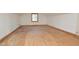 Unfinished attic with plywood floors, minimal light, and visible wiring; ready for customization at 104 Parker St, Oxford, NC 27565