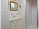 Bright bathroom featuring a mirror, vanity, sink, and stand-up shower with white tile and glass door at 104 Parker St, Oxford, NC 27565