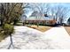 An angle showcasing the home's exterior, driveway, and yard on a sunny day at 104 Parker St, Oxford, NC 27565