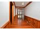 Inviting foyer with hardwood floors, wood paneling, and an open view of the front door at 104 Parker St, Oxford, NC 27565