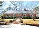 Charming brick home featuring a classic design, lush landscaping, and inviting curb appeal at 104 Parker St, Oxford, NC 27565