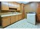 Practical laundry room equipped with a sink, and a washing machine at 104 Parker St, Oxford, NC 27565