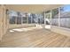 Relaxing screened porch with wooden floor, ample natural light and views of backyard at 104 Parker St, Oxford, NC 27565