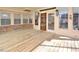 Inviting screened-in porch with wood flooring, brick accents and backyard views at 104 Parker St, Oxford, NC 27565