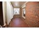 Brick sunroom with large windows and tile flooring at 104 Parker St, Oxford, NC 27565