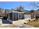 A screened sunroom is located on the back of the house with access to a wood patio at 104 Parker St, Oxford, NC 27565