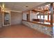 Sunroom with brick accent wall and wood beam ceiling at 104 Parker St, Oxford, NC 27565
