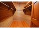 Spacious cedar walk-in closet with wood flooring and shelving, perfect for storage at 104 Parker St, Oxford, NC 27565