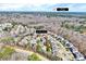 An aerial view of a residential community, located 18 miles from Raleigh, with mature trees and well-maintained homes at 105 Presley Snow Ct, Holly Springs, NC 27540