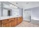 Bright bathroom boasts double sinks, a glass shower, and a soaking tub for ultimate relaxation at 105 Presley Snow Ct, Holly Springs, NC 27540
