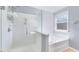 Bright bathroom features a glass shower and a luxurious soaking tub by a window at 105 Presley Snow Ct, Holly Springs, NC 27540