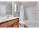 Full bathroom with shower-tub combo and wooden vanity at 105 Presley Snow Ct, Holly Springs, NC 27540