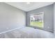 Simple bedroom with neutral carpet and natural light at 105 Presley Snow Ct, Holly Springs, NC 27540