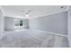 Bedroom featuring new carpet, a ceiling fan, and bright window at 105 Presley Snow Ct, Holly Springs, NC 27540