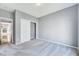 Empty bedroom with a closet, neutral carpet, and interior door at 105 Presley Snow Ct, Holly Springs, NC 27540
