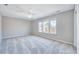 Bright bedroom with a ceiling fan and large windows at 105 Presley Snow Ct, Holly Springs, NC 27540