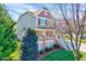 Beautiful two-story home featuring mixed siding, manicured lawn, and inviting front porch with white railings at 105 Presley Snow Ct, Holly Springs, NC 27540