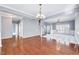 Spacious living room with hardwood floors leading to an adjacent room at 105 Presley Snow Ct, Holly Springs, NC 27540