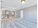 Open loft area with hardwood railing and a carpeted floor at 105 Presley Snow Ct, Holly Springs, NC 27540