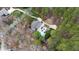 Aerial view of a residence featuring a private pool, outdoor entertaining area, and tree-lined property at 106 Woodkirk Ln, Chapel Hill, NC 27514