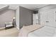Bedroom with cozy chair, carpeted floors and a comfortable bed at 106 Woodkirk Ln, Chapel Hill, NC 27514