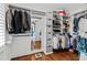 Organized walk-in closet with custom shelving and ample storage space for clothes at 106 Woodkirk Ln, Chapel Hill, NC 27514