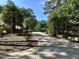 Long, private driveway leading to a beautiful home surrounded by mature trees and landscaping, creating a grand entrance at 106 Woodkirk Ln, Chapel Hill, NC 27514