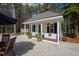 Charming guest house with a welcoming porch, surrounded by lush landscaping and a serene outdoor space at 106 Woodkirk Ln, Chapel Hill, NC 27514