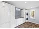 Well-organized laundry room with modern washer, dryer, and ample storage, perfect for efficient chores at 106 Woodkirk Ln, Chapel Hill, NC 27514