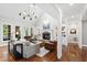 Bright living room boasts vaulted ceilings, fireplace, and ample natural light from large windows at 106 Woodkirk Ln, Chapel Hill, NC 27514