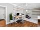 Bright office space with custom shelving, a modern desk, and an ergonomic chair at 106 Woodkirk Ln, Chapel Hill, NC 27514