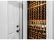 Wine cellar with custom wood racking to store wine bottles, located just off of a door at 106 Woodkirk Ln, Chapel Hill, NC 27514