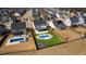 Aerial view of a home with a pool and putting green in the backyard at 1213 Valley Dale Dr, Fuquay Varina, NC 27526