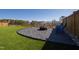 Well-manicured backyard with a fire pit area featuring gravel and Adirondack chairs at 1213 Valley Dale Dr, Fuquay Varina, NC 27526