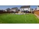 Backyard featuring a putting green, pool, gazebo and manicured landscaping at 1213 Valley Dale Dr, Fuquay Varina, NC 27526