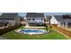 Aerial view of a backyard with a kidney-shaped pool and patio area at 1213 Valley Dale Dr, Fuquay Varina, NC 27526