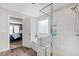 The bathroom features a glass enclosed shower, large tub, and wood look ceramic tile at 1213 Valley Dale Dr, Fuquay Varina, NC 27526
