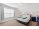 Cozy bedroom boasts natural light, carpet floors, and a comfortable setting at 1213 Valley Dale Dr, Fuquay Varina, NC 27526