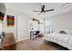 A cozy bedroom with carpet, a ceiling fan, natural light, and custom decor at 1213 Valley Dale Dr, Fuquay Varina, NC 27526