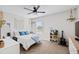 Bright bedroom with ceiling fan, neutral paint, carpet flooring, and decor creates a calm and relaxing retreat at 1213 Valley Dale Dr, Fuquay Varina, NC 27526