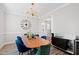 Dining room featuring stylish furniture and decor, with a modern lighting fixture at 1213 Valley Dale Dr, Fuquay Varina, NC 27526