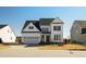 Charming two-story home with a well-manicured lawn and a two-car garage at 1213 Valley Dale Dr, Fuquay Varina, NC 27526