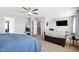 This is a bright main bedroom with neutral carpet, a ceiling fan, and plenty of natural light at 1213 Valley Dale Dr, Fuquay Varina, NC 27526