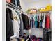Walk-in closet provides ample storage, shelving, and hanging space for organization and accessibility at 1213 Valley Dale Dr, Fuquay Varina, NC 27526