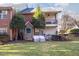 View of the backyard featuring well-maintained lawn and balcony with ceiling fan at 1221 Renshaw Ct, Cary, NC 27518