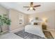 Inviting bedroom with neutral tones, plush carpeting, a ceiling fan, and a decorative window at 1221 Renshaw Ct, Cary, NC 27518